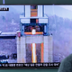 A man watches a TV news program from South Korea showing an image of a high-thrust rocket engine in North Korea on March 19, 2017 (AP Photo/Ahn Young-joon)